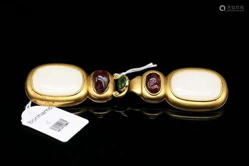 A White Jade and Garnet Buckle, Qing Dynasty (Bonhams London...