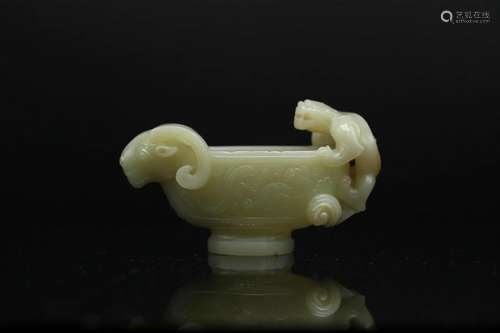 A Yellowish Celadon Jade 'Goat-Head' Vessel, Ming Dy...