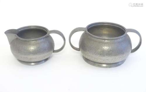 An early 20thC Tudric pewter milk jug and sugar bowl. Both s...
