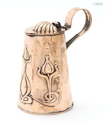 An Art Nouveau copper lidded jug of tapering form with loop ...