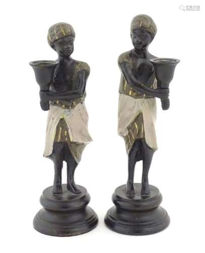 Two 20thC cast Blackamoor figural candlesticks with painted ...
