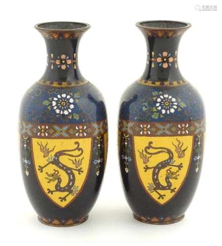 A pair of Oriental cloisonne vases decorated with panels of ...