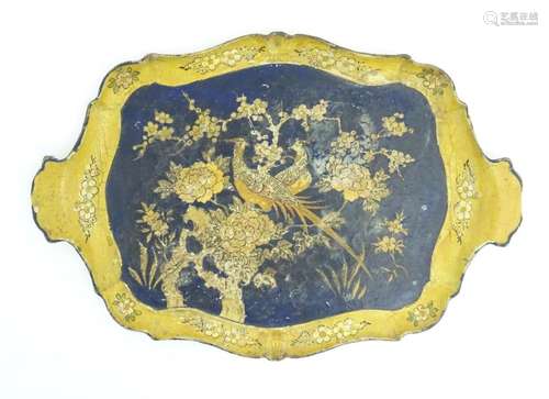 A 19thC lacquered papier mache tray of shaped form decorated...