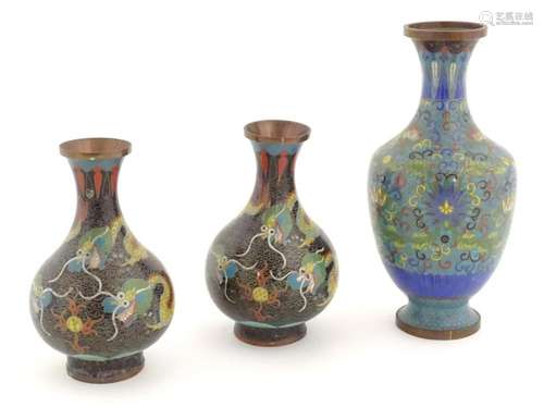 Three Oriental cloisonne vases, one decorated with scrolling...