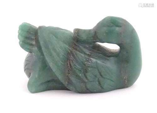 An Oriental hardstone spinach jade green coloured carving mo...