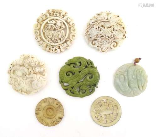 Seven assorted carved Oriental roundels / pendants, detail t...