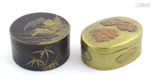 An Oriental brass snuff box / oval box with hinged lid, with...