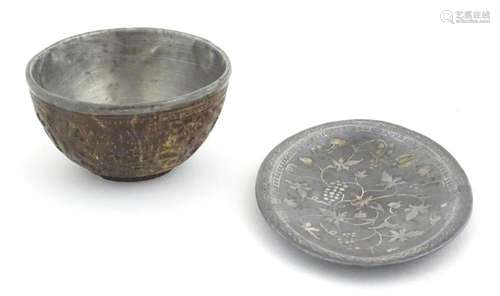 A small carved coconut bowl with carved Oriental decoration ...