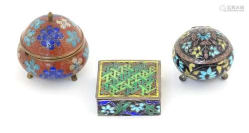 An Oriental cloisonne pot and cover with floral decoration. ...