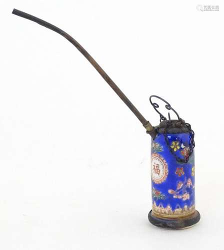 A Chinese ceramic opium pipe, the ceramic body with floral d...