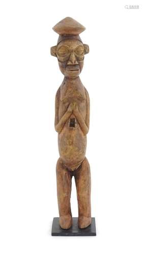 Ethnographic / Native / Tribal: An African carved wood stand...