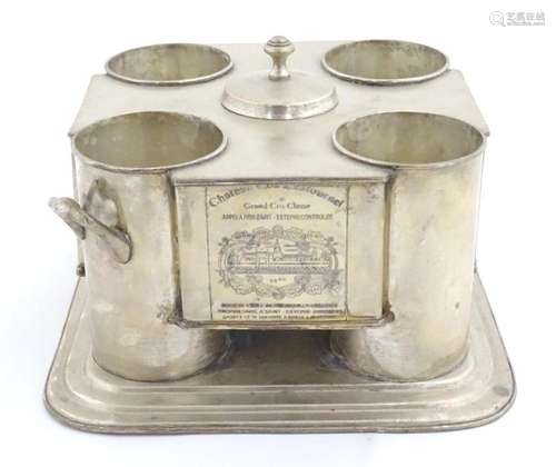 A 20thC silver plate twin handled four bottle wine cooler wi...