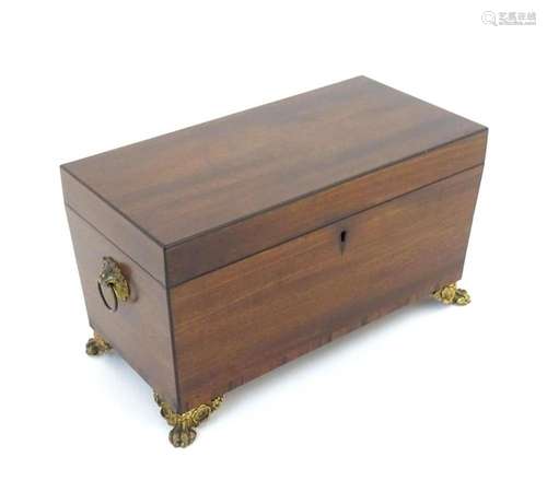 A 19thC mahogany tea caddy with twin brass ring handles and ...