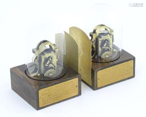 A pair of 20thC bookends with replicas of the Edison Stock T...