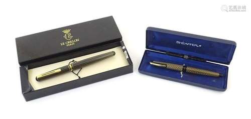 A boxed Le Crillon, Paris fountain pen, together with a Shea...