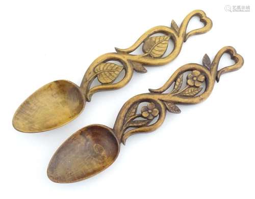 Two 20thC Welsh carved sycamore love spoons with foliate dec...