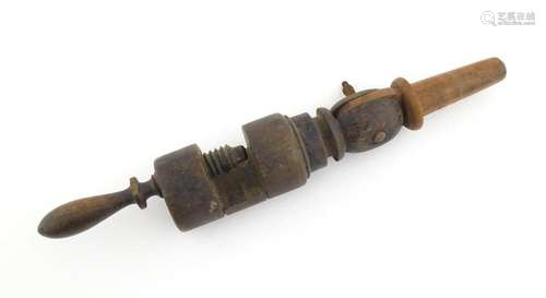 A 19thC turned wooden wig clamp. Approx. 13 1/2"