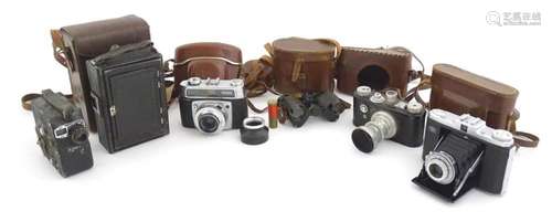 A quantity of 20thC cased cameras to include a Zeiss Ikon Ne...