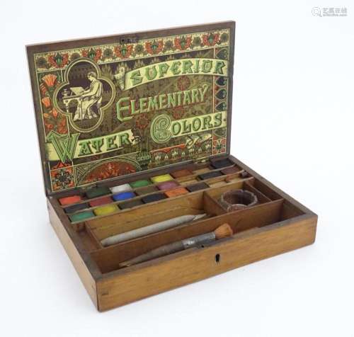 A late 19thC artist's wooden paint box with paper label ...