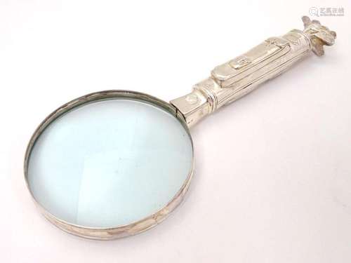 A novelty magnifying glass, the handle formed as a golf bag ...