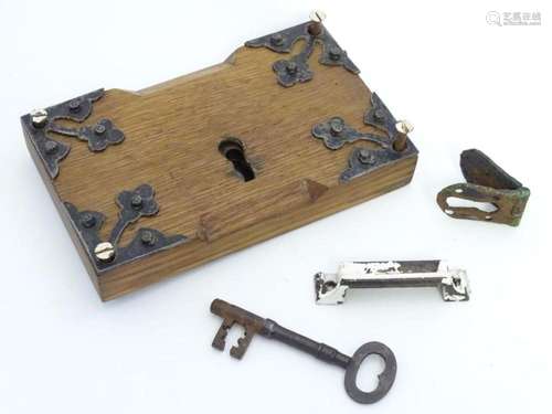 An 18thC door lock mechanism and key, with fittings, mounted...