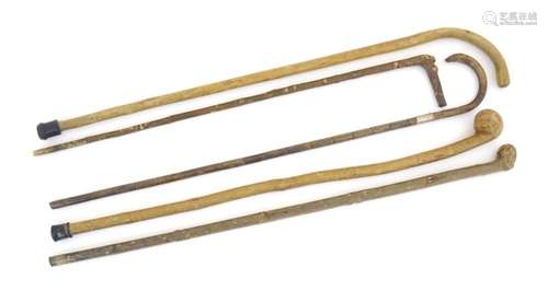 Five assorted 20thC walking sticks / canes to include one wi...