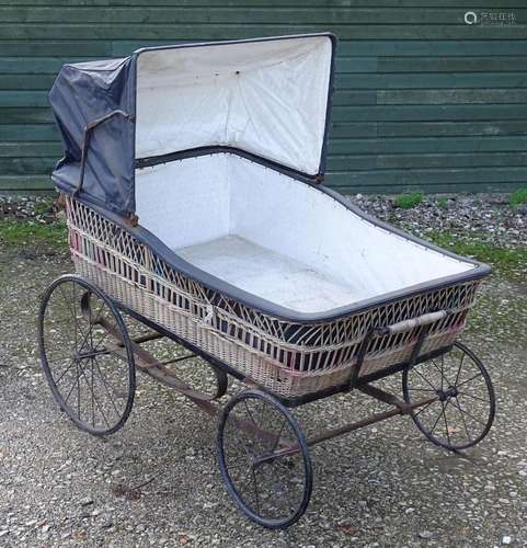 A large Victorian pram / spinal / invalid carriage.