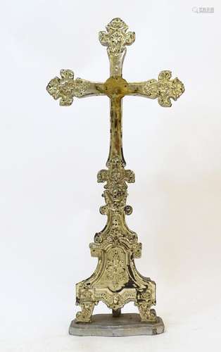 A 19thC crucifix, the wooden cross with embossed gilt metal ...