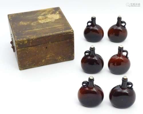 A Victorian wooden box opening to reveal 6 fitted sections w...