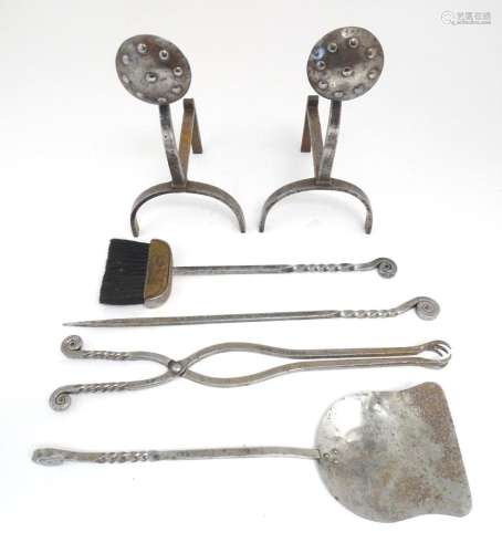 A set of four 20thC steel fire tools the handles with twist ...