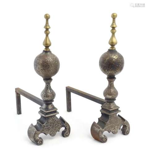 A pair of 19thC brass and cast iron fire dogs, the uprights ...
