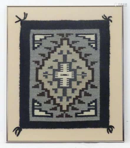 A 20thC Navajo woven textile / sampler with geometric decora...