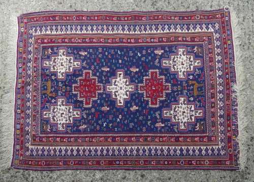 Carpet / rug : An Afghan fine weave rug having a blue ground...