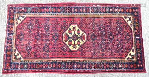 Carpet / rug : A Malayer rug having red ground with repeated...