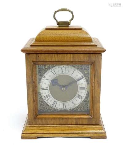 A 20thC walnut cased mantle clock with brass dial and silver...