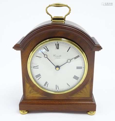 A Comitti battery powered mantel clock. Approx 8 1/2" h...