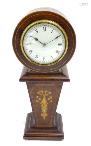 A mahogany mantle clock with inlaid detail and white enamel ...