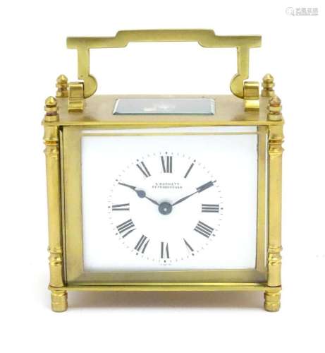 A French brass cased carriage clock with white enamel dial s...