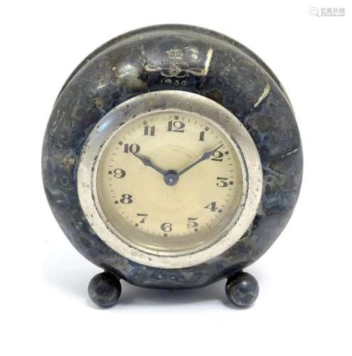 A table clock with silver plate surround engraved with crown...