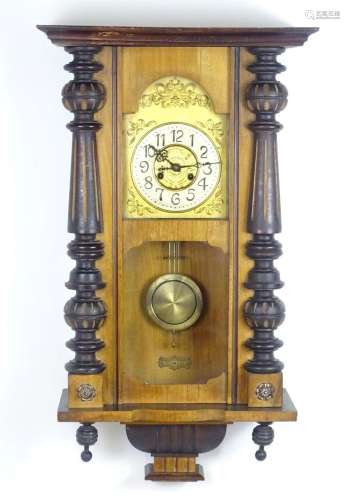 A late 19thC / early 20thC Vienna wall clock with embossed A...