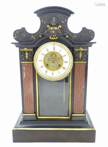 A black slate mantel clock with rouge marble and gilt highli...