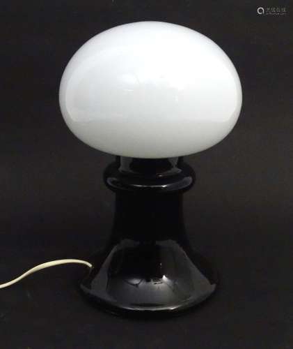 A black glass table lamp with white glass shade of mushroom ...