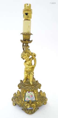 A Continental cast bronze and gilt metal table light with Se...