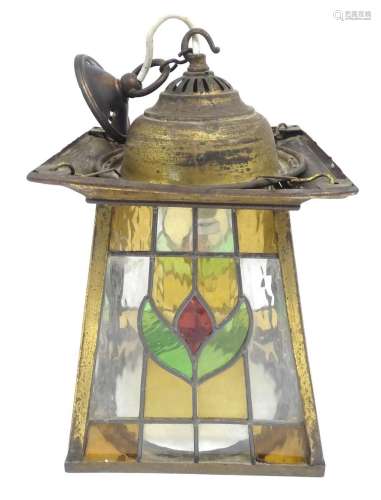 An Arts and Crfts pendant light of lantern form with leaded ...