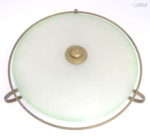 A retro ceiling light, the brass frame with circular glass s...