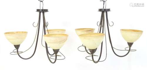 A pair of 3 branch lights with scroll detail and shades. App...