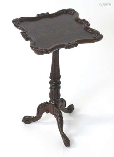 A Victorian oak wine table in the manner of Gillows with a c...