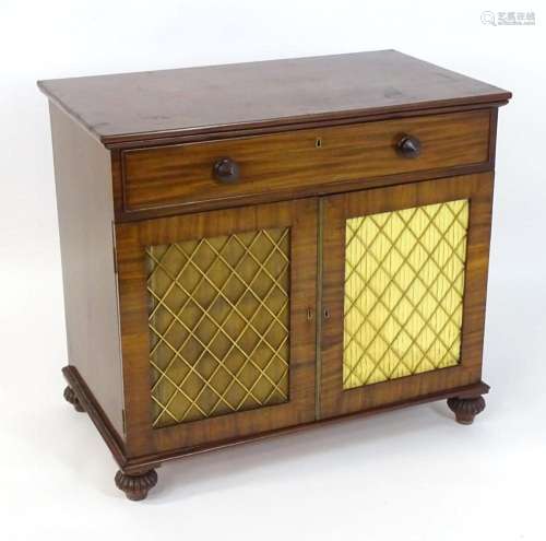 A Regency mahogany drawing room cabinet of rectangular form,...