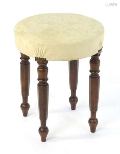 A 19thC oversized mahogany stool, having a circular top abov...