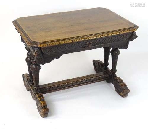 A late 19thC oak writing desk / centre table, having a cante...